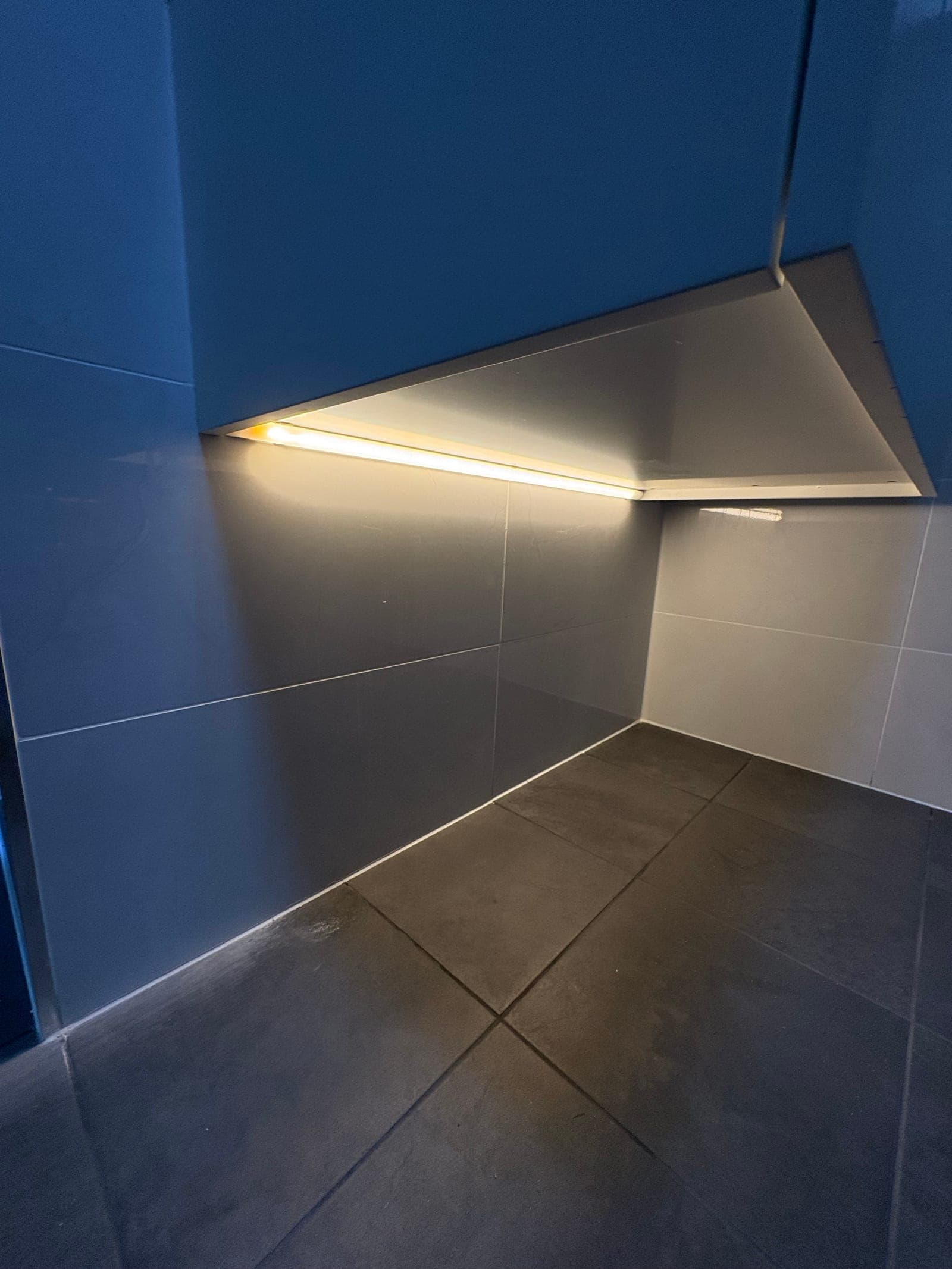 Bathroom LED strip floor lighting installed during renovation