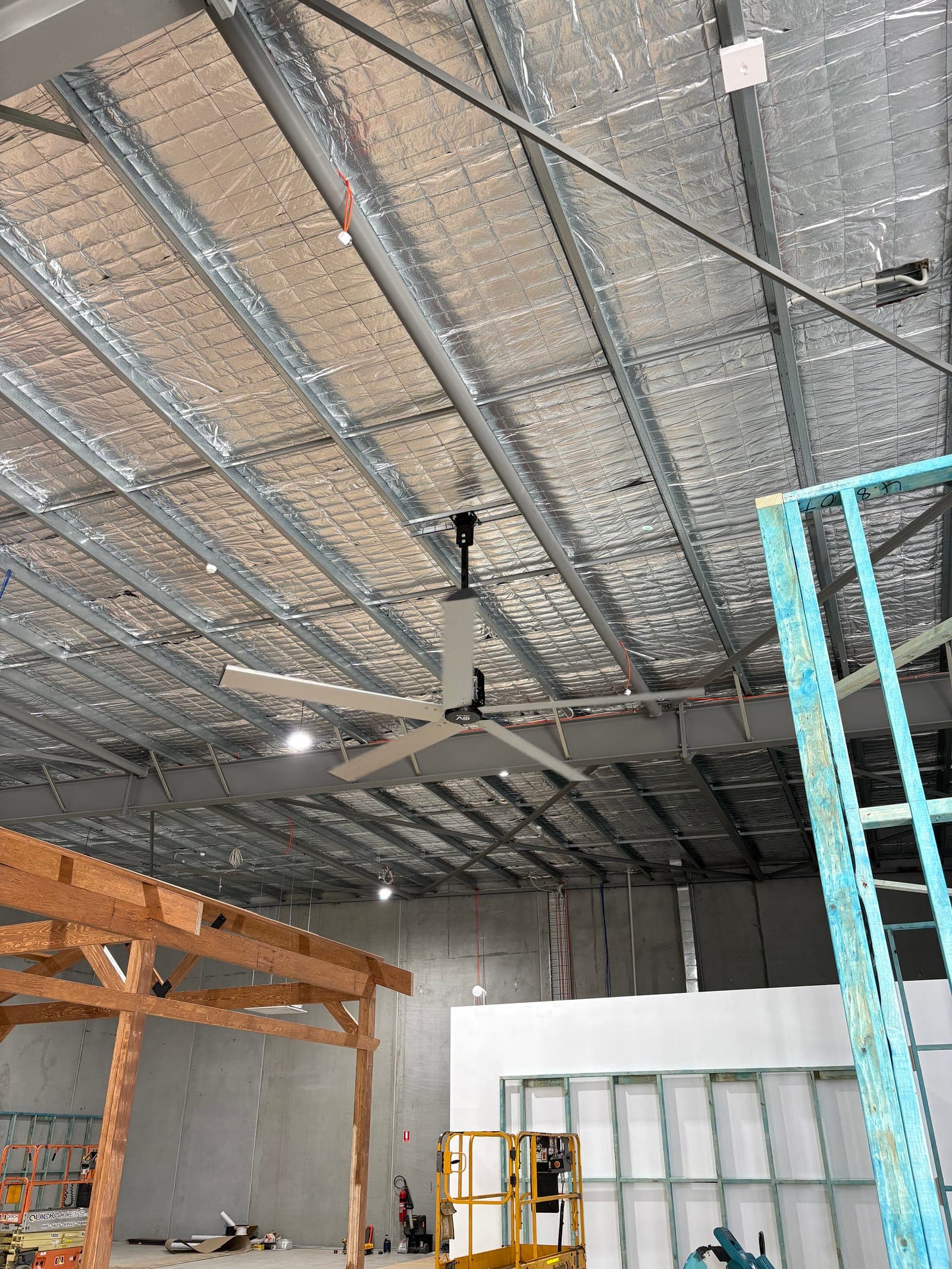 Commercial warehouse fitout with HVLS ceiling fan and high-bay lighting